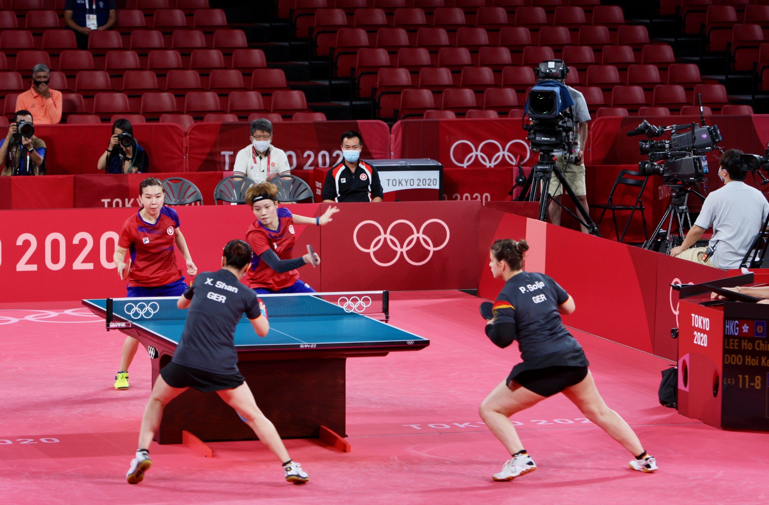 Athletes playing table tennis